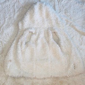 White furry hooded vest